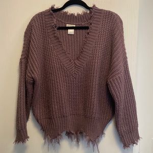 Distressed style sweater